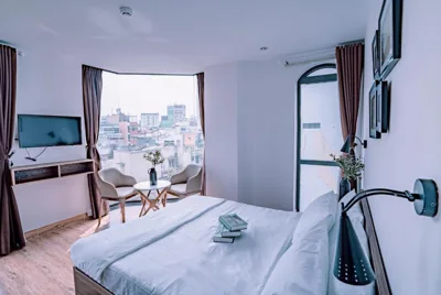 Chambre double Deluxe avec balcon — Mint Hotel Bui Vien Q1